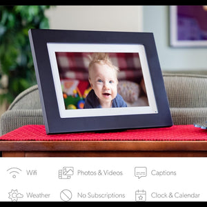 Hostecno Photoshare 10" WiFi digital picture frame with HD touchscreen, black wood frame, displays baby photo.