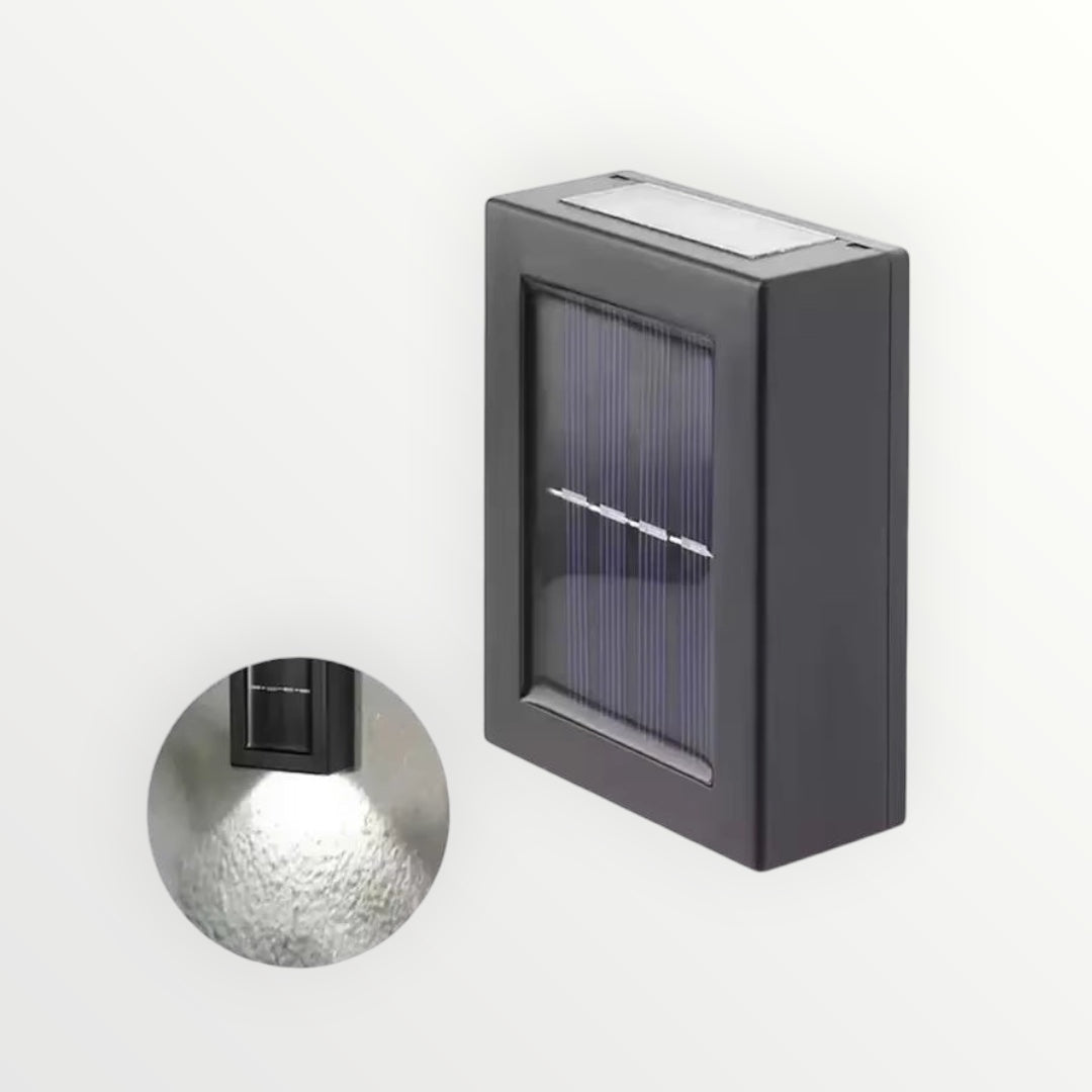 Hostecno black solar outdoor spotlight with up and down light, waterproof IP65 rated, ideal for gardens and walls.